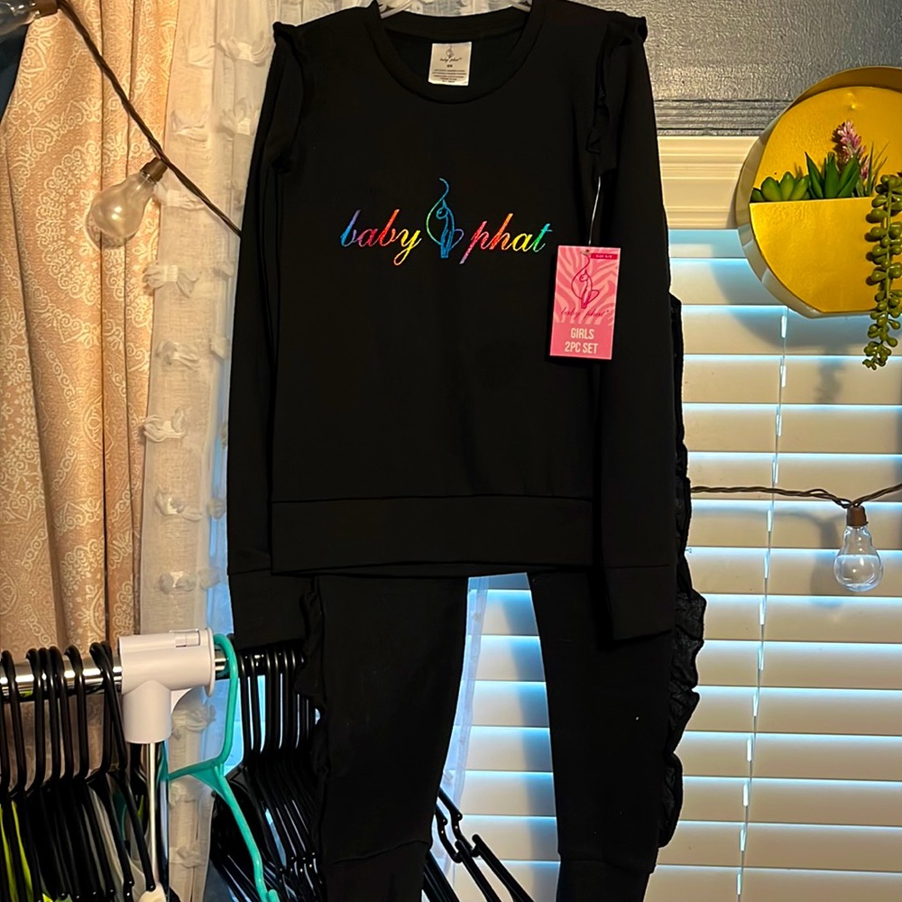 The cutest girls baby phat 2 piece set! Size girls 5/6. Brand new with tag.